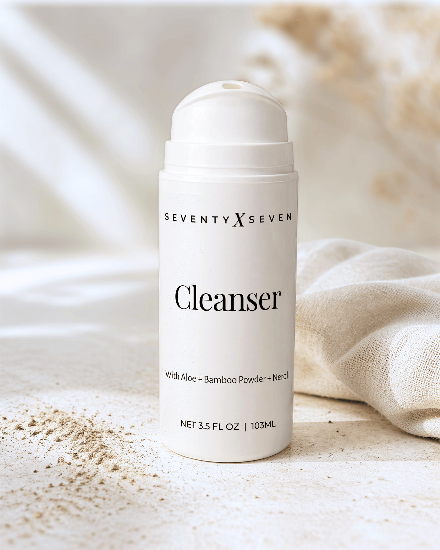 White airless pump bottle filled with natural cleanser on a neutral beige textured background with soft natural light and minimal linen styling