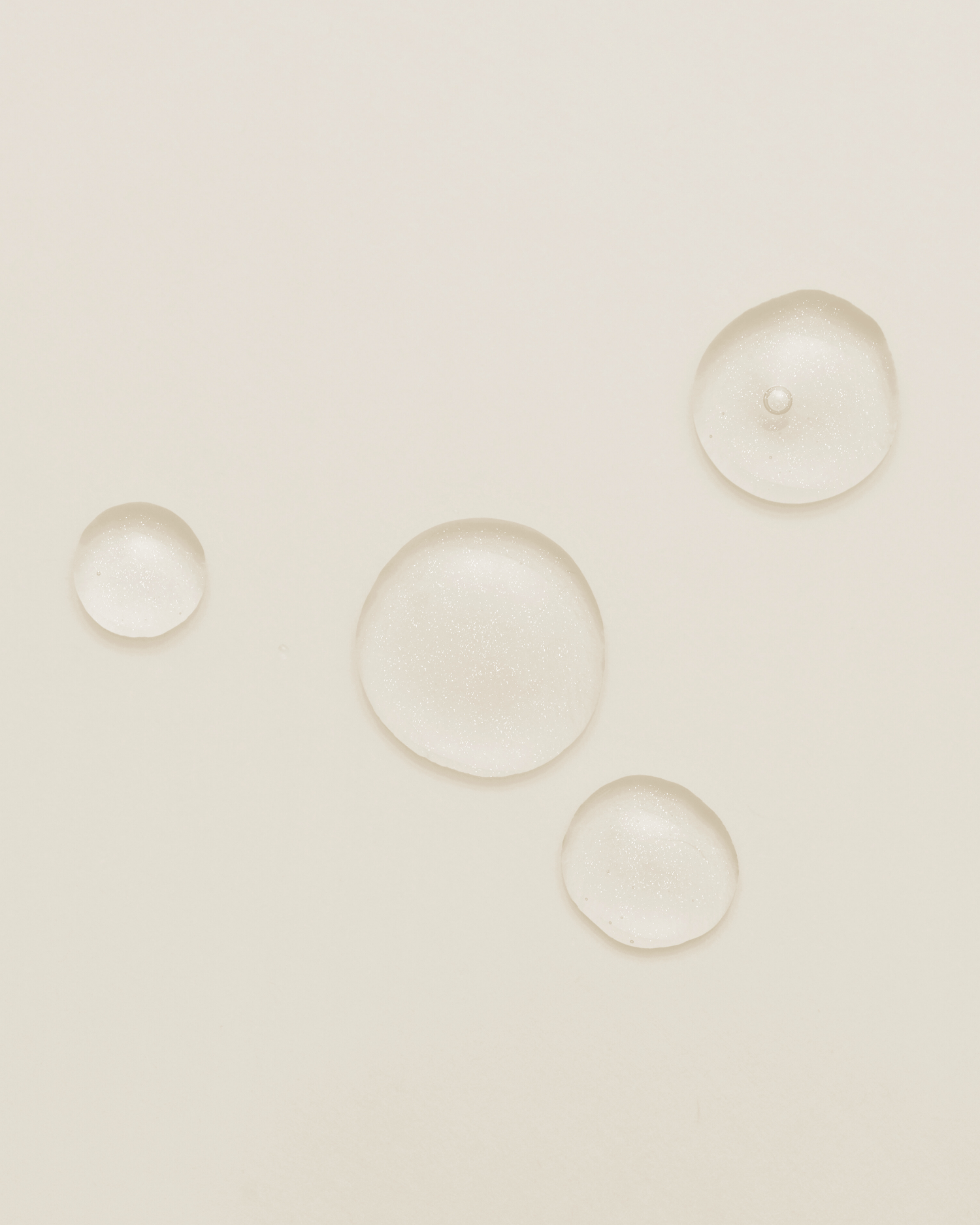 Clear gel cleanser texture on neutral beige background