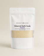 Lavender mineral bath soak in white mylar bag with window on neutral backdrop